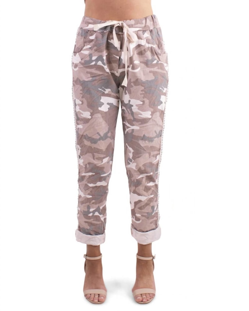 Front of a model wearing a size O/S Stretch Camo Pants In Pale Pink in Pale Pink by Jacqueline B Clothing. | dia_product_style_image_id:356031